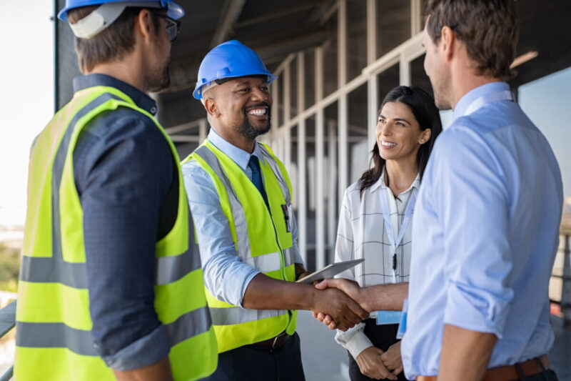 engineer-and-businessman-handshake-at-construction-site-stockpack-adobe-stock.jpg Engineer and businessman handshake at construction site