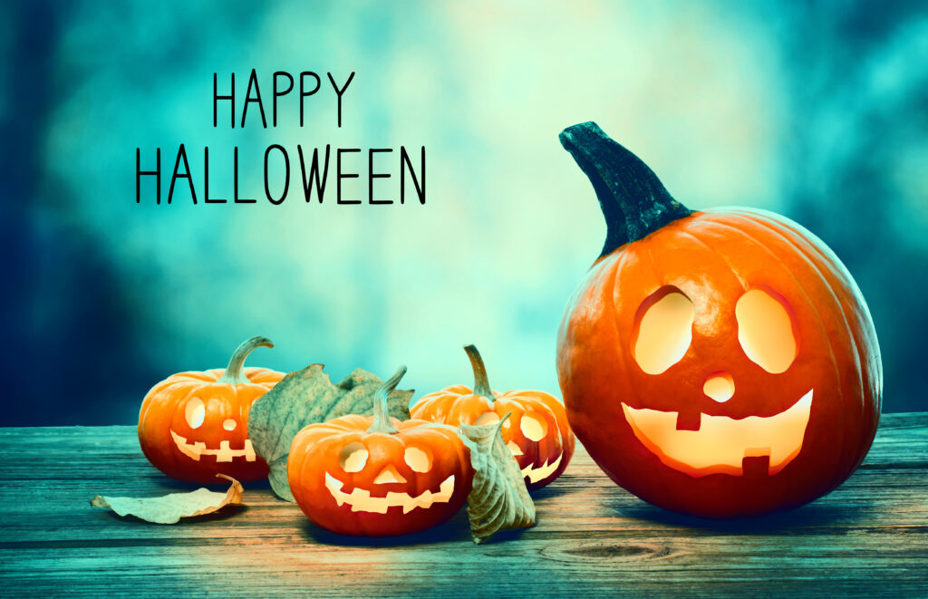 Happy Halloween with pumpkins on a spooky forest at night