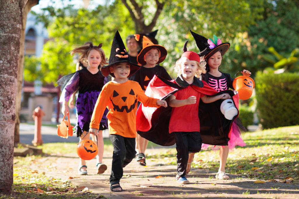 Kids trick or treat. Halloween fun for children.