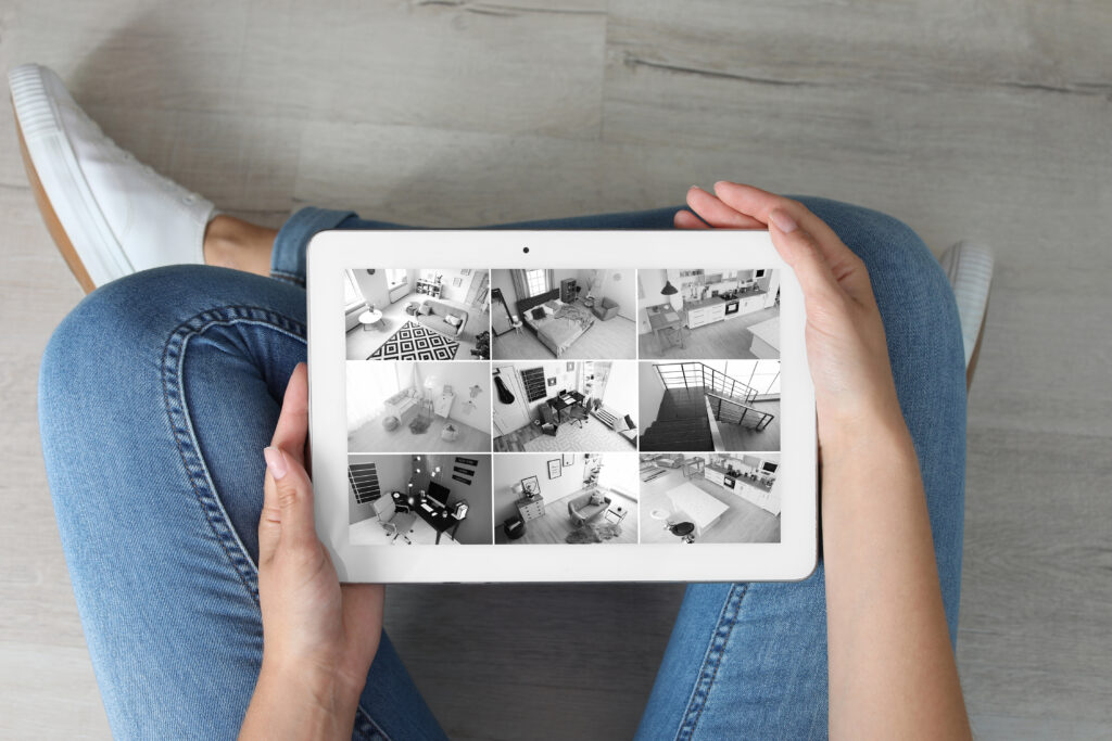 Woman holding tablet with blank screen indoors. Mockup for design