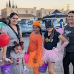 Batgirl Pennywise and family costumes at Valley Alarm Trunk-or-Treat San Fernando Valley 2025