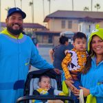 Family with baby Buzz Lightyear Spider-Man and harlequin costumes at Valley Alarm Truck-or-Treat 2025