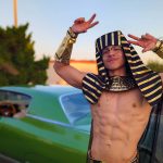 Egyptian pharaoh costume with gold headdress and cape in front of classic green lowrider at Valley Alarm Trunk-or-Treat San Fernando Halloween 2025