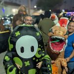 Inflatable alien and dinosaur costumes Valley Alarm Trunk-or-Treat San Fernando Valley 2025