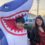 Inflatable shark costume siblings at Valley Alarm Trunk-or-Treat San Fernando Valley Halloween 2025