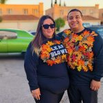 Creative leaf blower couple costumes covered in autumn leaves at Valley Alarm Trunk-or-Treat San Fernando Halloween 2025