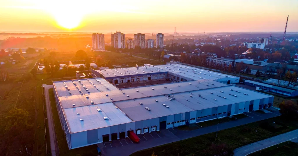 Aerial view of distribution center at dusk showing after-hours warehouse security vulnerability in Los Angeles