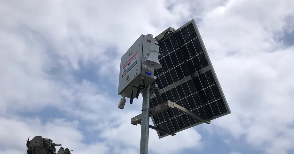ValleyGuard live video monitoring unit mounted on a Los Angeles construction site with audio speaker for real-time intervention