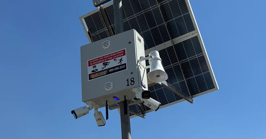 Valley Alarm solar pole-mounted security camera monitoring a commercial parking lot in Los Angeles
