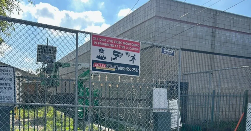 ValleyGuard remote video monitoring sign on the gate of a vacant property in Los Angeles